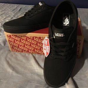 Black Vans sneakers